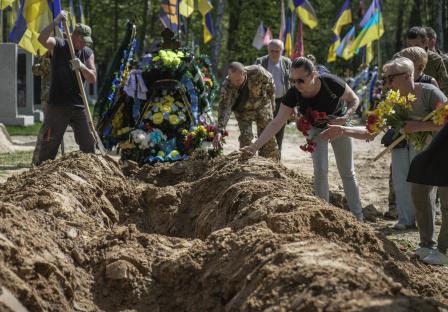 Funeral ceremony for Ukrainian servicemen at a military cemetery.