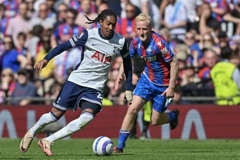 Djed Spence of Tottenham Hotspur and Will Hughes of Crystal Palace competing for the ball during a Premier League match.