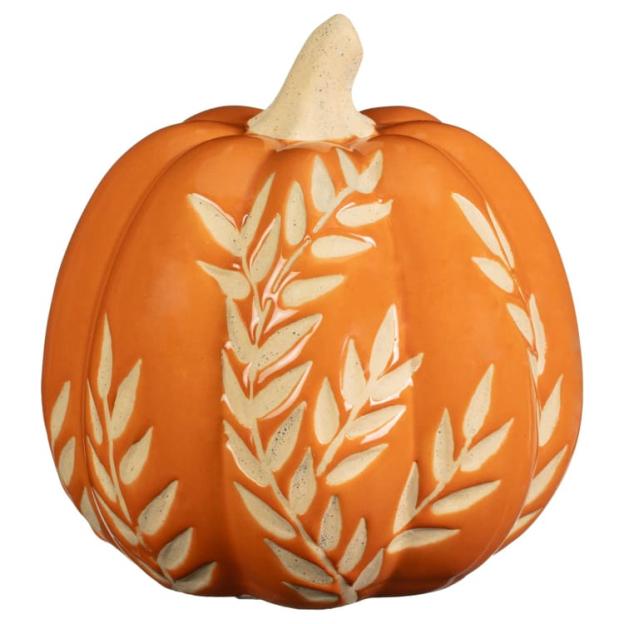 Orange ceramic pumpkin with off-white leaf design.