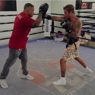 Boxer training in a boxing ring.