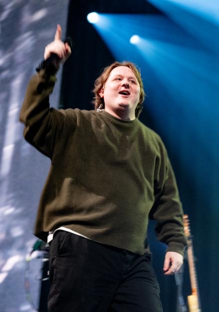 Lewis Capaldi performing on stage.