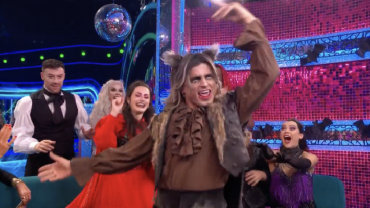 Amber Davies and other cast members dressed in Halloween costumes.