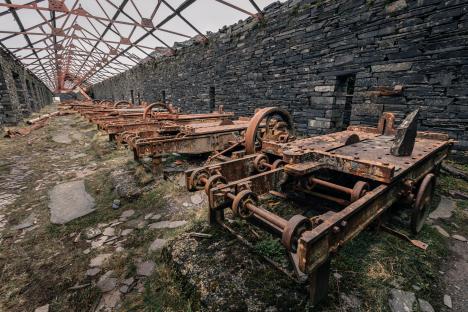 Rusty machinery in a slate quarry.