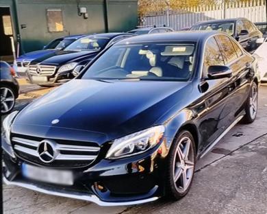 Black Mercedes C-Class car.