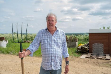 Jeremy Clarkson holding a pitchfork on his farm.