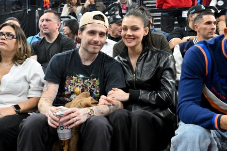Brooklyn Beckham and Nicola Peltz at a basketball game.