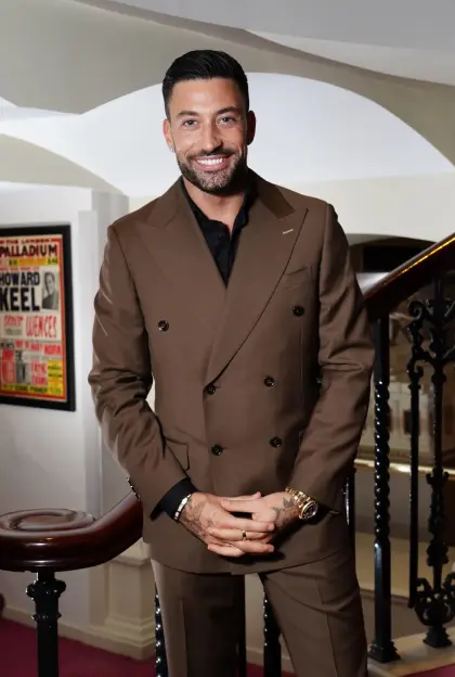 Giovanni Pernice in a brown suit.