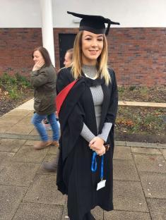 Graduate in cap and gown.