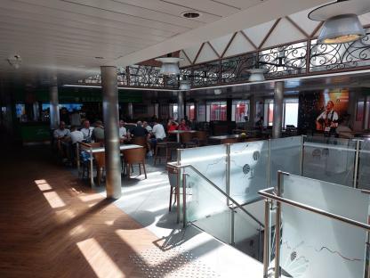 Passengers relaxing in a ferry lounge.