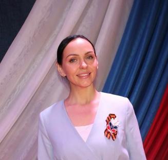 Ksenia Shevtsova, daughter of a Russian mayor, wearing a light blue jacket.