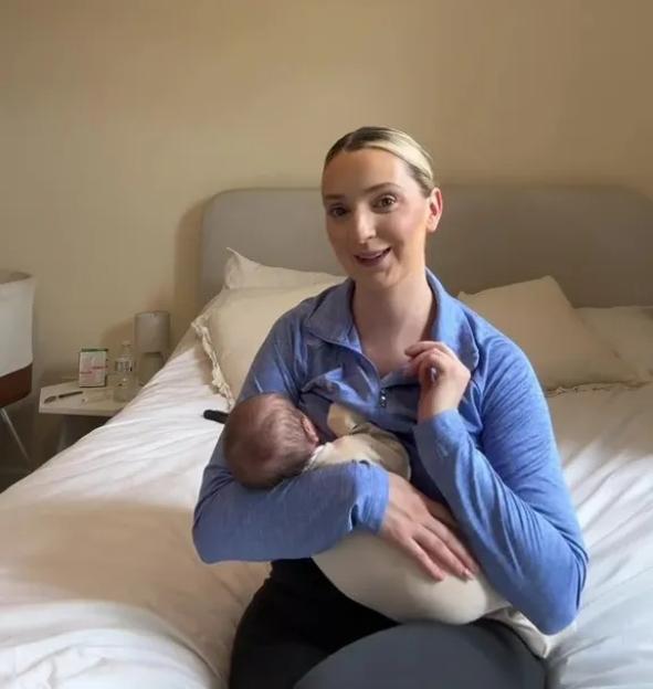Woman breastfeeding newborn baby.