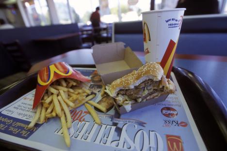 McDonald's meal with burger, fries, and soda.