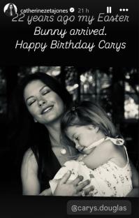 Black and white photo of Catherine Zeta-Jones holding her daughter Carys Douglas.