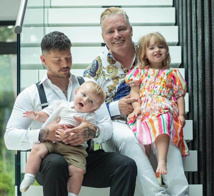 Barrie Drewitt-Barlow with his partners and children.