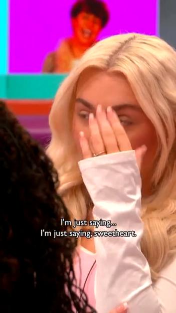 A woman with blonde hair covers her face with her hand, a ring on her finger, with text 'I'm just saying... I'm just saying, sweetheart.'