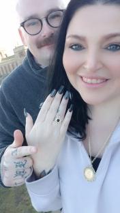 Woman showing off her engagement ring.