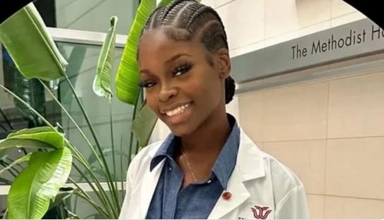 Photo of Tamilore Odunsi in a white lab coat.