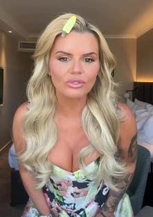 Kerry Katona showing off her weight loss in a floral dress.