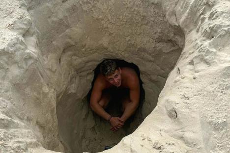 Moment Brit beachgoer is saved after being swallowed by quicksand in 8ft hole he’d dug -as he says ‘I thought I’d die’
