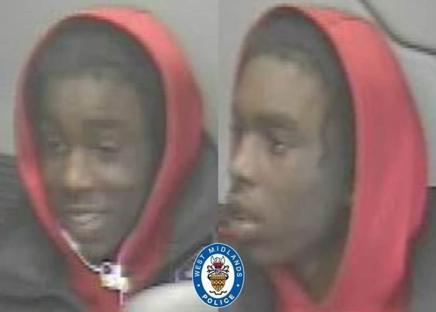 CCTV image of a person wearing a red hoodie.