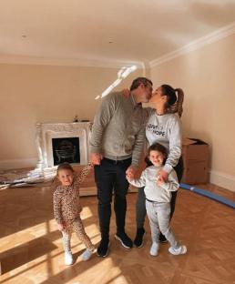 Family of four in their new home.