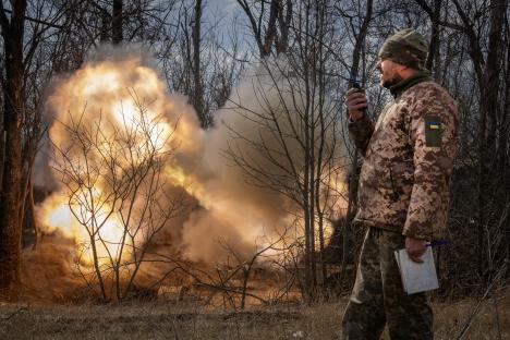 Ukrainian officer observing artillery fire.