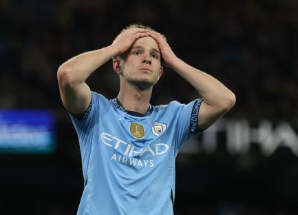 Manchester City's James McAtee with hands on head.