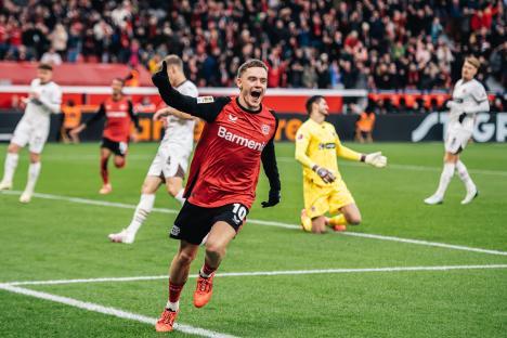 Florian Wirtz of Bayer 04 Leverkusen celebrating a goal.