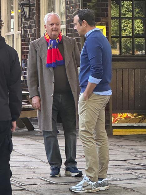 Photo of two men on the set of Ted Lasso.
