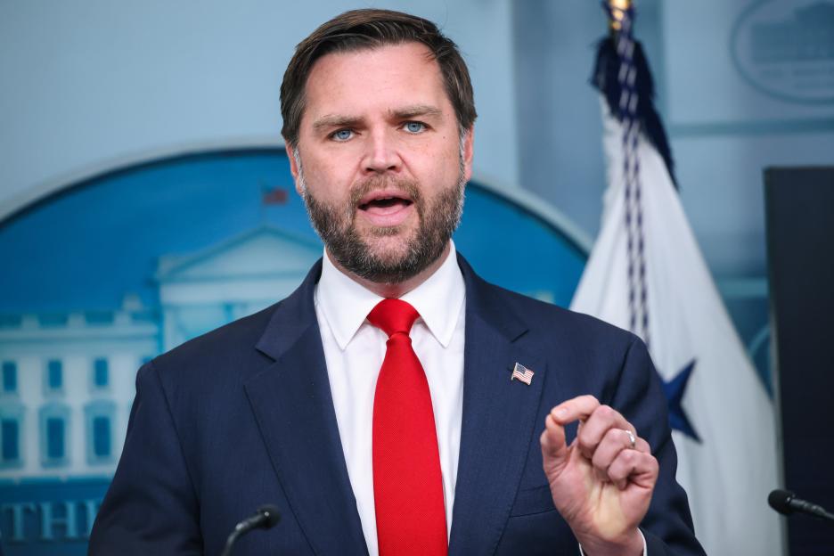 JD Vance speaking at a press briefing in the James S. Brady Press Briefing Room at the White House.