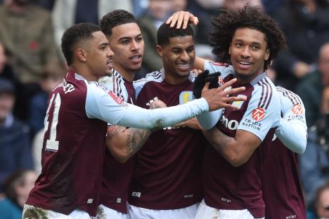 Aston Villa soccer players celebrating a goal.