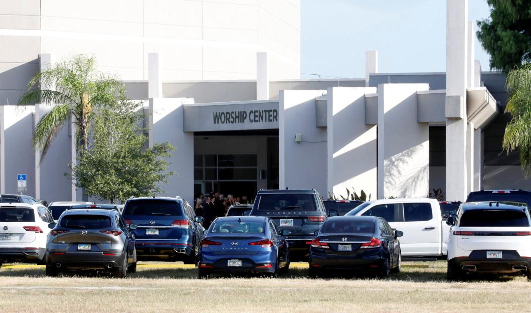 Mourners gathered outside a worship center.