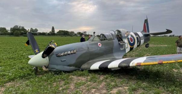 World War II Spitfire crash-landed in a field.