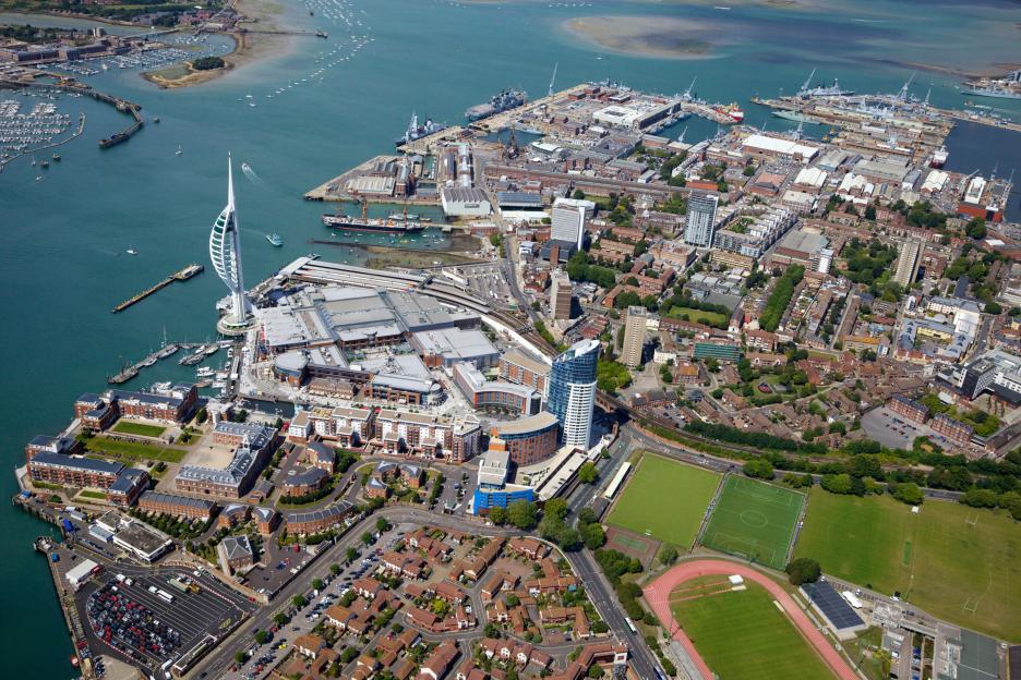 Aerial view of Portsmouth, England, featuring the Spinnaker Tower and Gunwharf Quays.