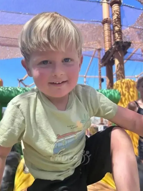 Young boy at a playground.