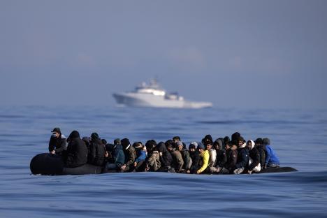 Migrants in an inflatable boat crossing the English Channel.