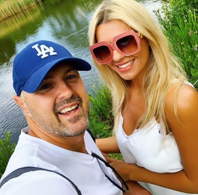 Christine McGuinness and Paddy McGuinness by a lake.