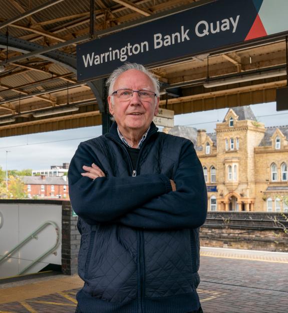 Peter Waterman OBE 78, a railway enthusiast, at Warrington Bank Quay Station.