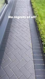 Painted driveway with herringbone brick pattern.