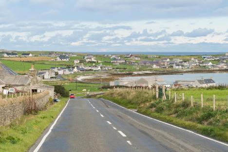 Road leading to Pierowall, the largest village on Westray, Orkney Islands.