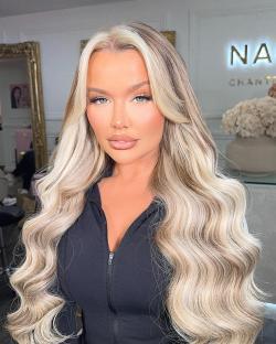 Paige Williams, founder of P Louise cosmetics, with long blonde hair.