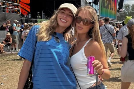 Zara McDermott cuddles up to Louis Tomlinson’s sister at Glastonbury as romance gets family seal of approval