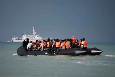 Migrants in an inflatable dinghy crossing the English Channel.