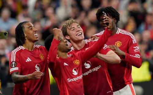 Manchester United players celebrating a goal.
