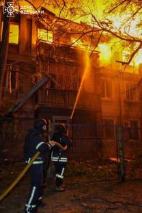 Firefighters battling a large building fire.