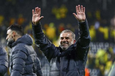 Ange Postecoglou, Tottenham Hotspur coach, salutes fans.