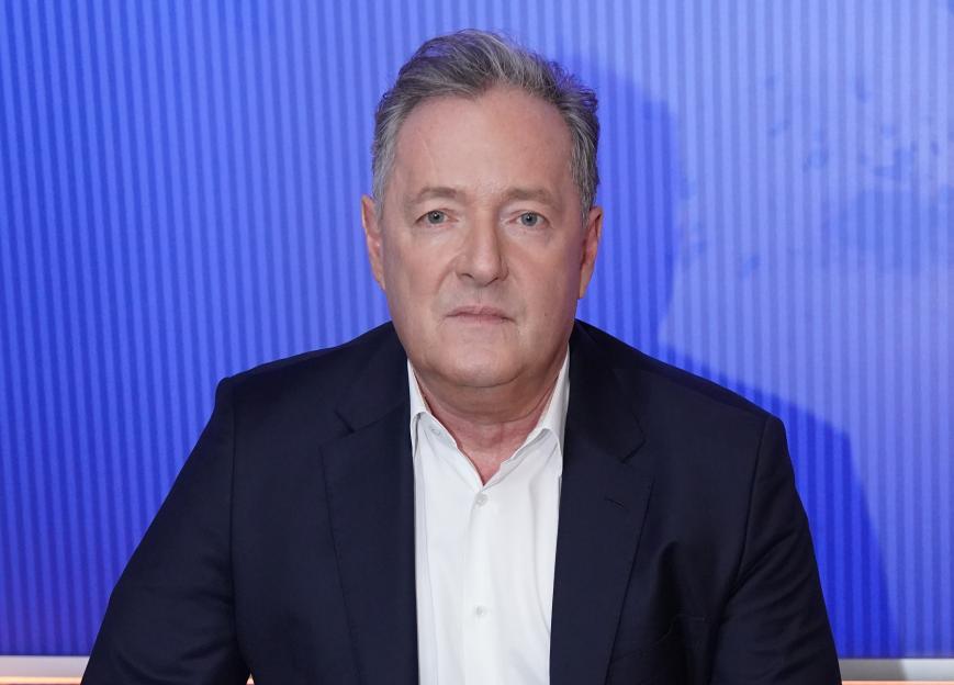 Piers Morgan in a suit during an interview.