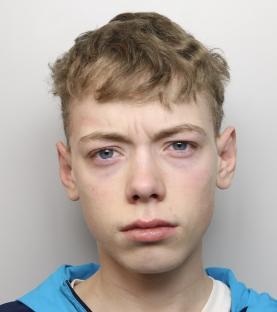 Mugshot of a young man with light blond hair.