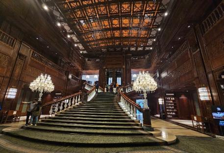 Grand staircase in an ornate building.