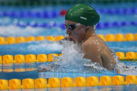 A swimmer competing in the 100m breaststroke final.